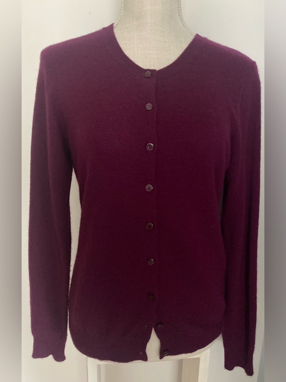 Cardigan in a rich plum color. 100% Cashmere
